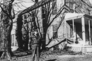 Captain John Bowie, Jr. (Grandson of William Anderson, of Grassland, the builder), United States Coast and Geodetic Survey, Retired, standing in front of the Grassland home a few years before his death in 1986